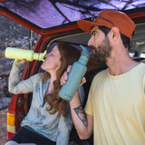 Couple drinking - tip and sip with Flip Seal Sport Cap