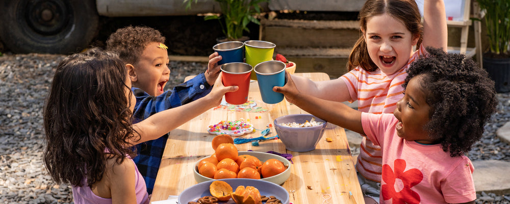 Kids' Drinking from Cups at Table