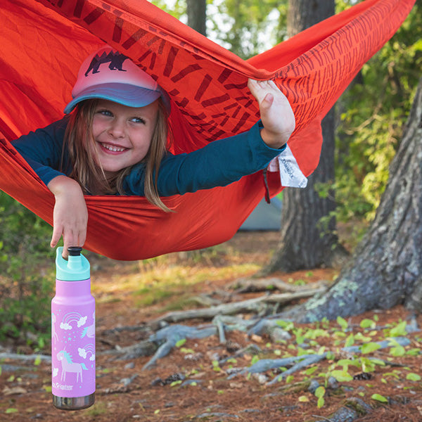 Girl in hammock with water bottle