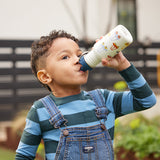 Boy drinking from Sippy bottle