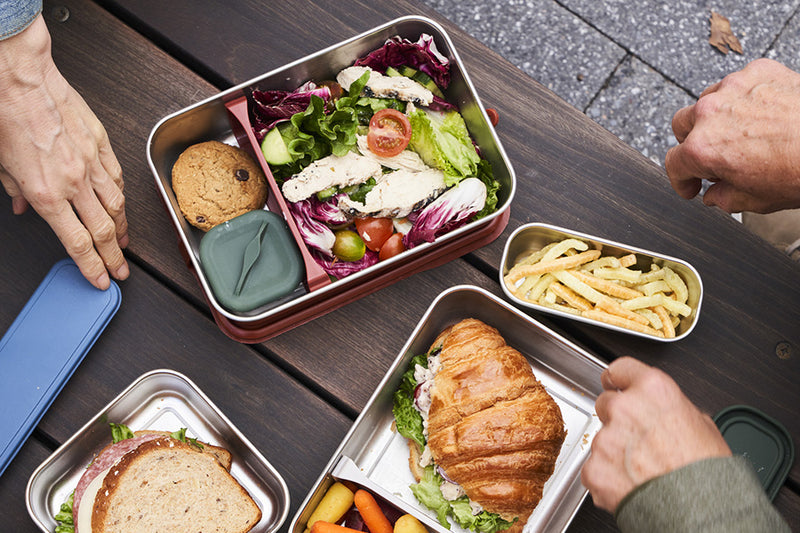 Steel lunch boxes and food containers - top view